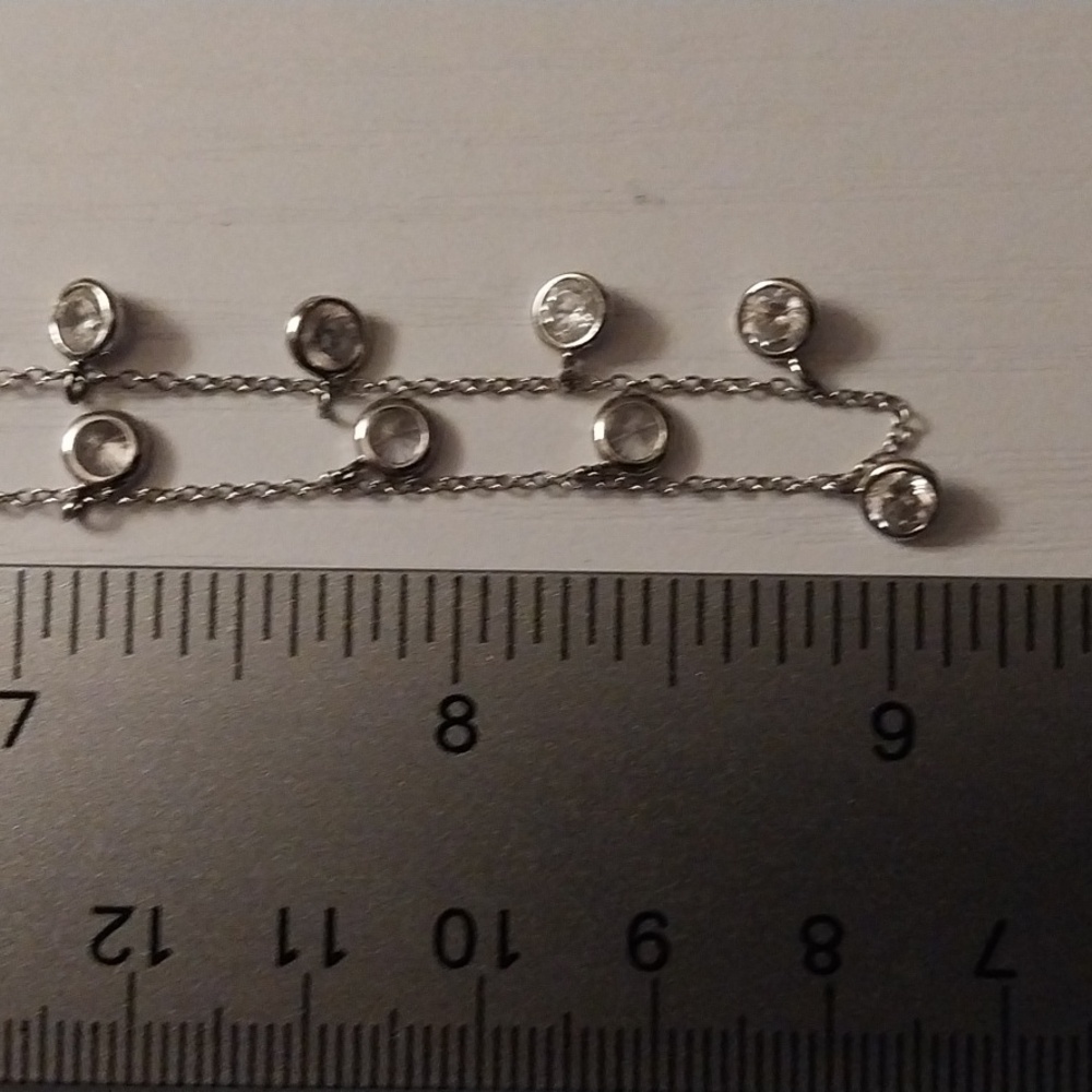 Sterling silver necklace w/ 15 cz's in 1/2" stations.